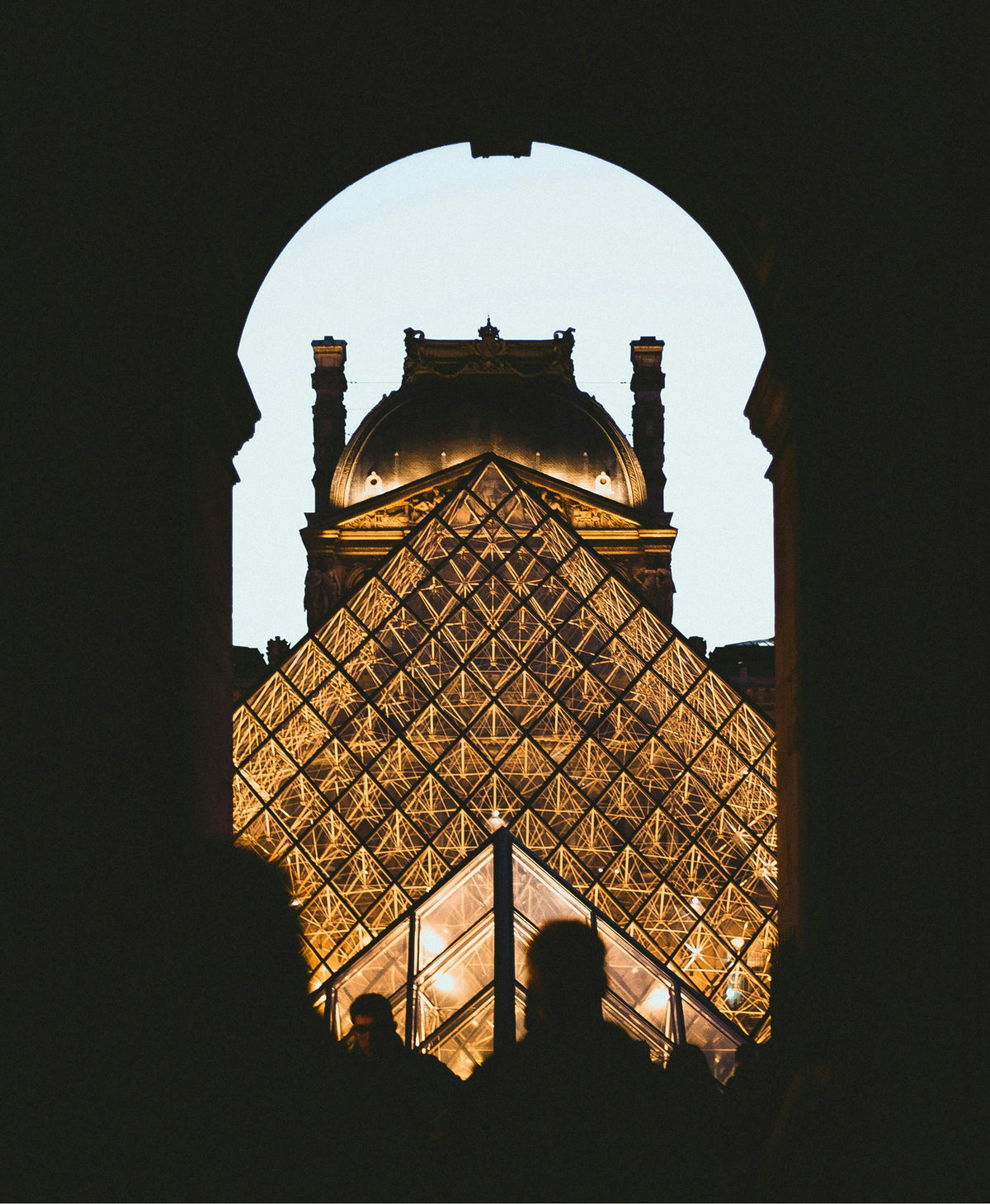 The Louvre pyramid at dusk, the art of a daily sunscreen ritual